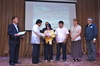 Mr. Andres Baaco III  and Ms. Virginia Catain receive the award for 1Lt. Andres Baaco Sr..JPG